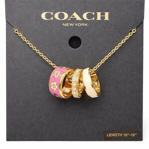 COACH Gold-Tone Pink & Cream Enamel Ring Pendant Necklace